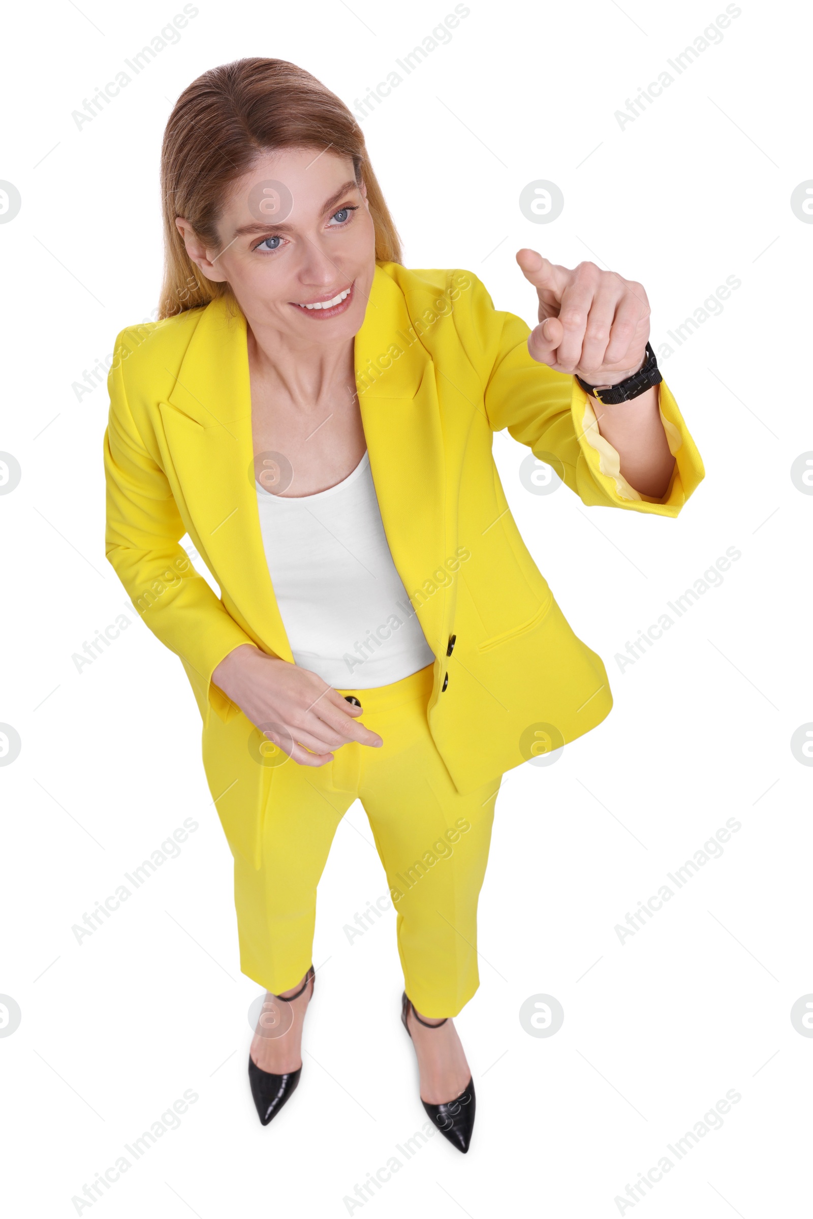 Photo of Beautiful happy businesswoman pointing at something on white background, above view