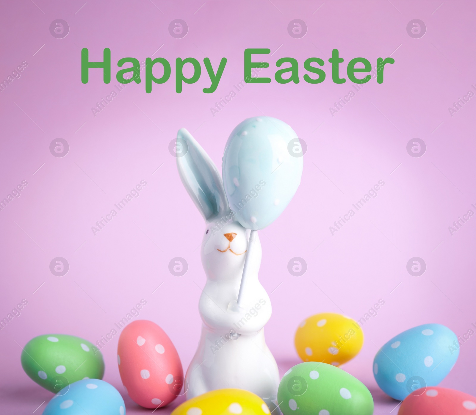 Image of Easter bunny figure and eggs on pink background