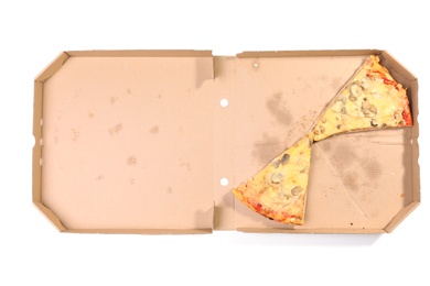 Cardboard box with pizza pieces on white background, top view