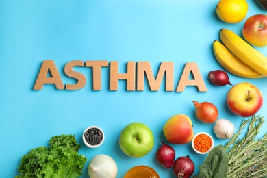 Photo of Flat lay composition with natural products as home remedies and word ASTHMA on color background