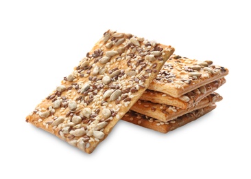 Photo of Stack of delicious crispy crackers with different seeds isolated on white