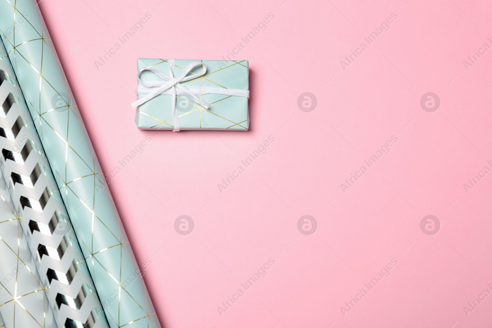 Photo of Flat lay composition with beautiful gift box and space for text on color background