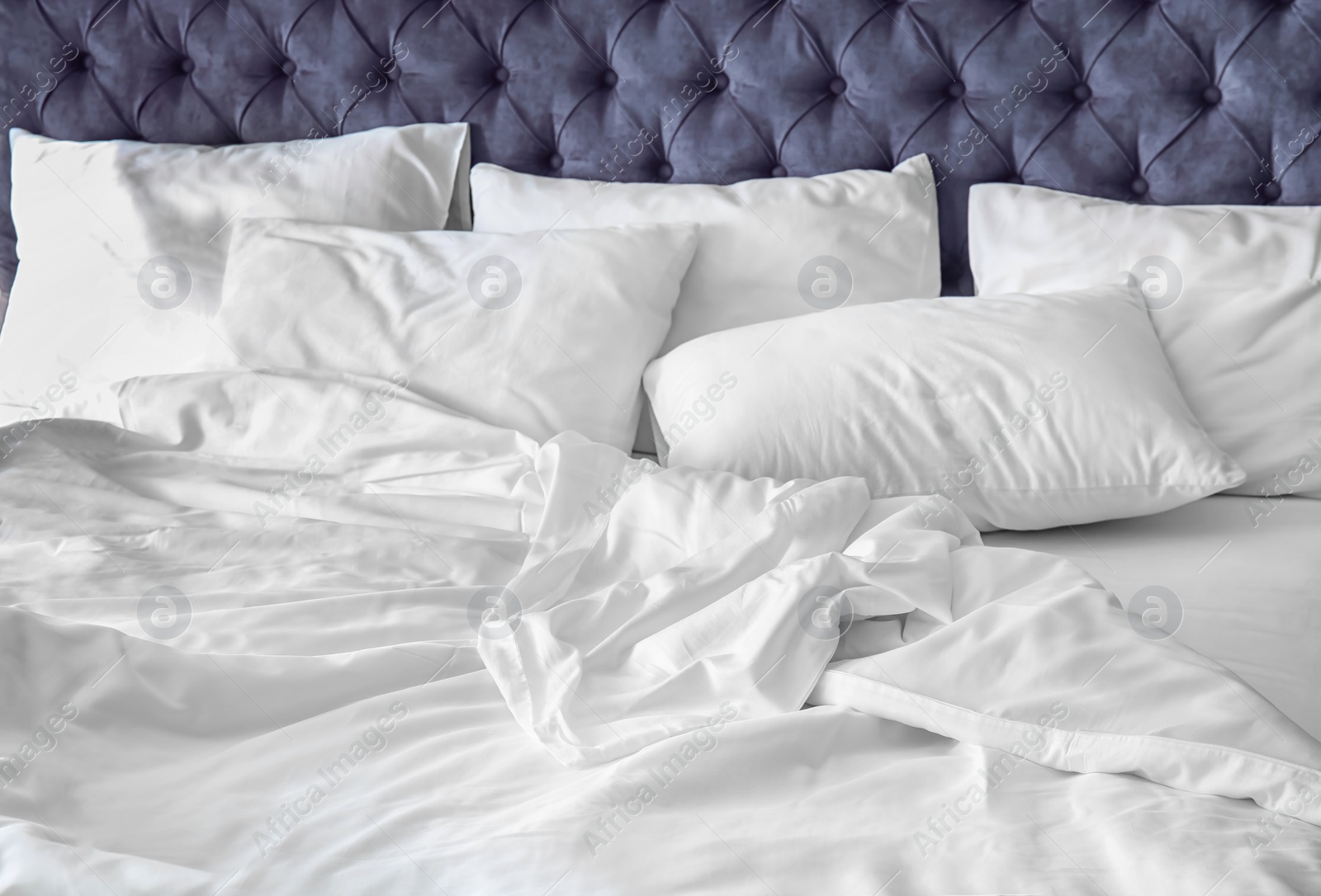 Photo of Comfortable bed with white linen at home