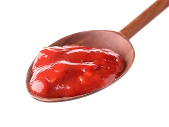 Wooden spoon with red sauce on white background