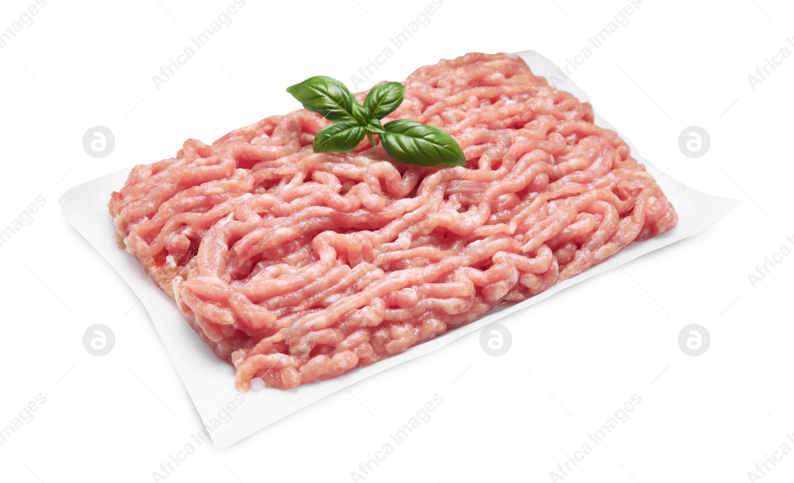 Photo of Raw chicken minced meat with basil on white background