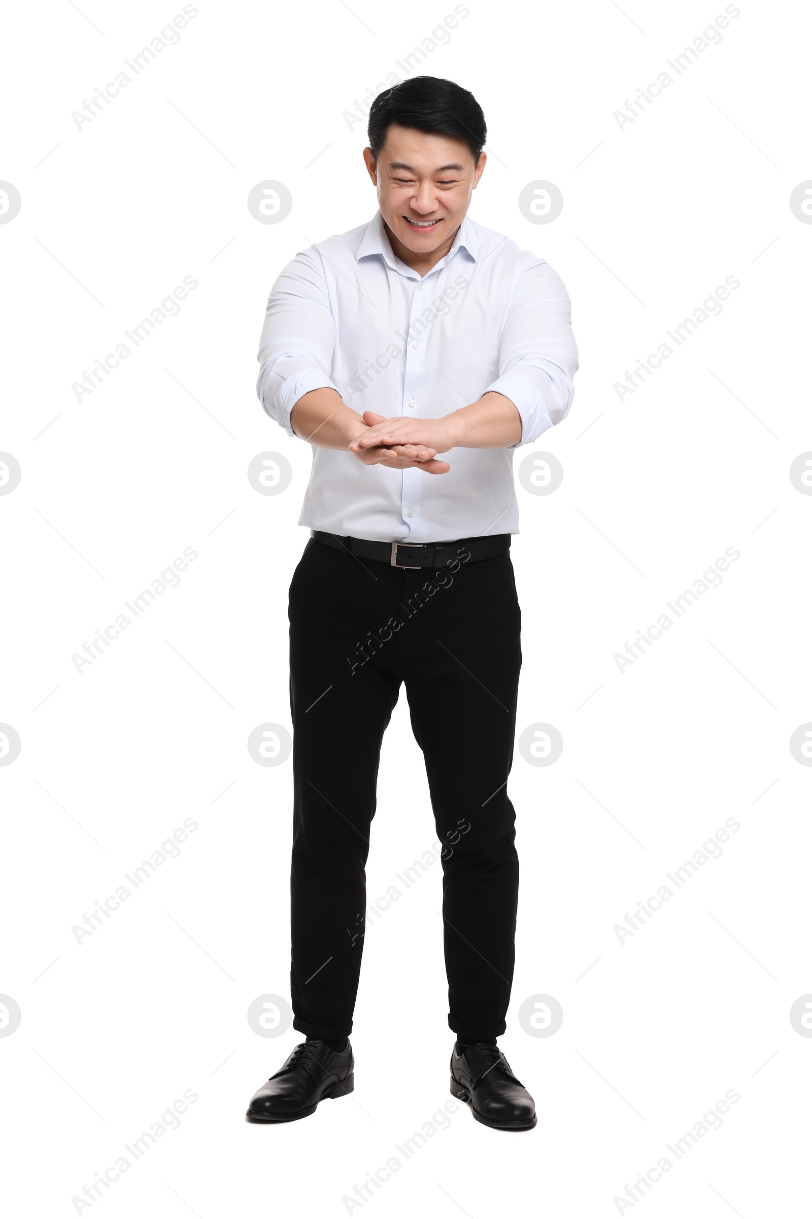 Photo of Businessman in formal clothes posing on white background