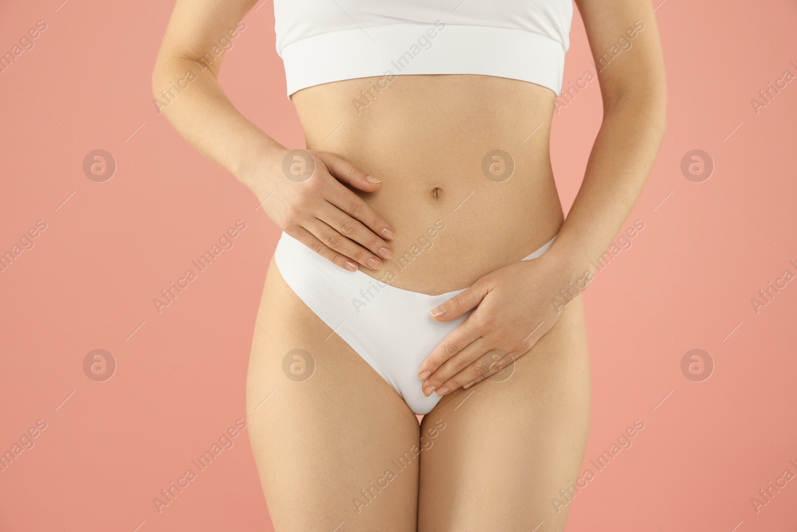 Photo of Gynecology. Woman in underwear on pink background, closeup