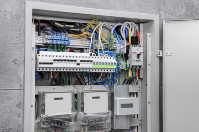 Photo of Fuse box with many electric meters and wires