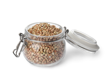 Photo of Organic green buckwheat in glass jar isolated on white