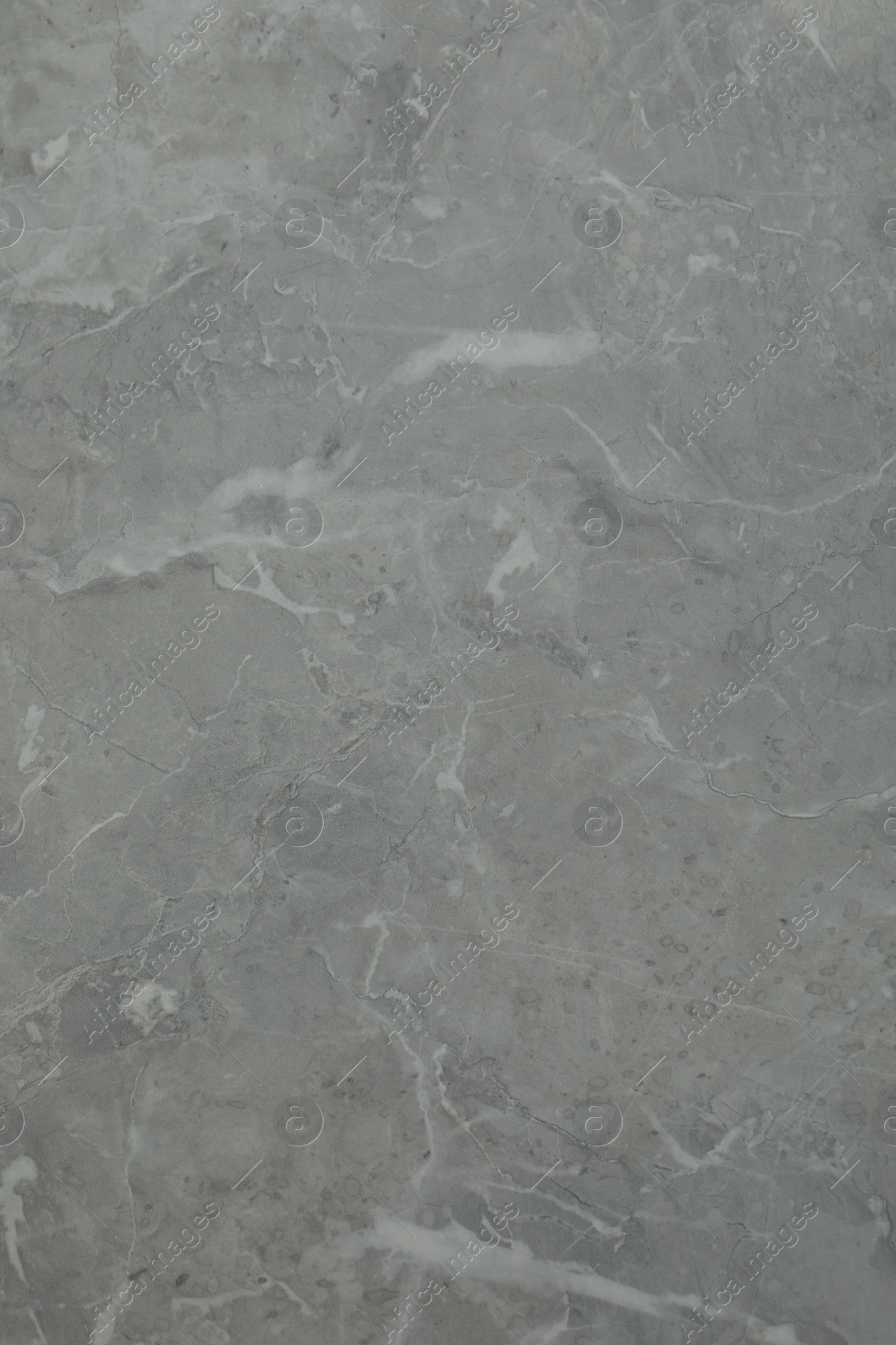 Photo of Texture of light grey marble surface as background, closeup