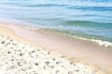 Photo of Sandy beach near sea on sunny day