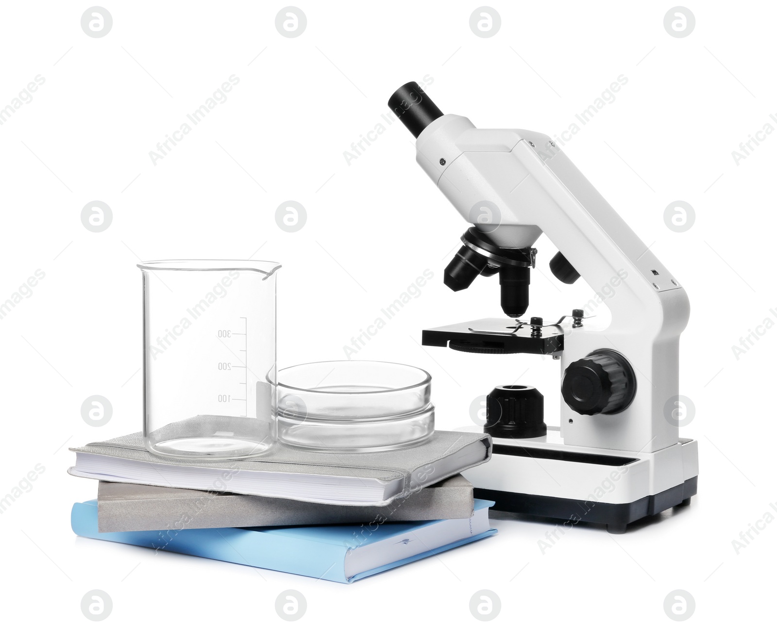 Photo of Microscope, books and medical students stuff isolated on white