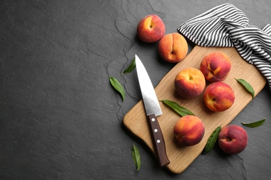 Photo of Fresh sweet peaches on black table, flat lay. Space for text