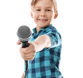 Cute boy with microphone on white background