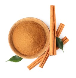Photo of Dry aromatic cinnamon sticks, powder and green leaves isolated on white, top view