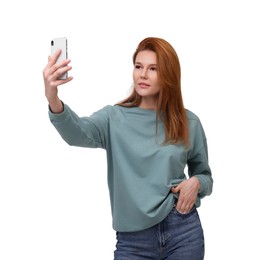 Beautiful woman taking selfie on white background