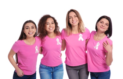 Photo of Group of women with silk ribbons on white background. Breast cancer awareness concept