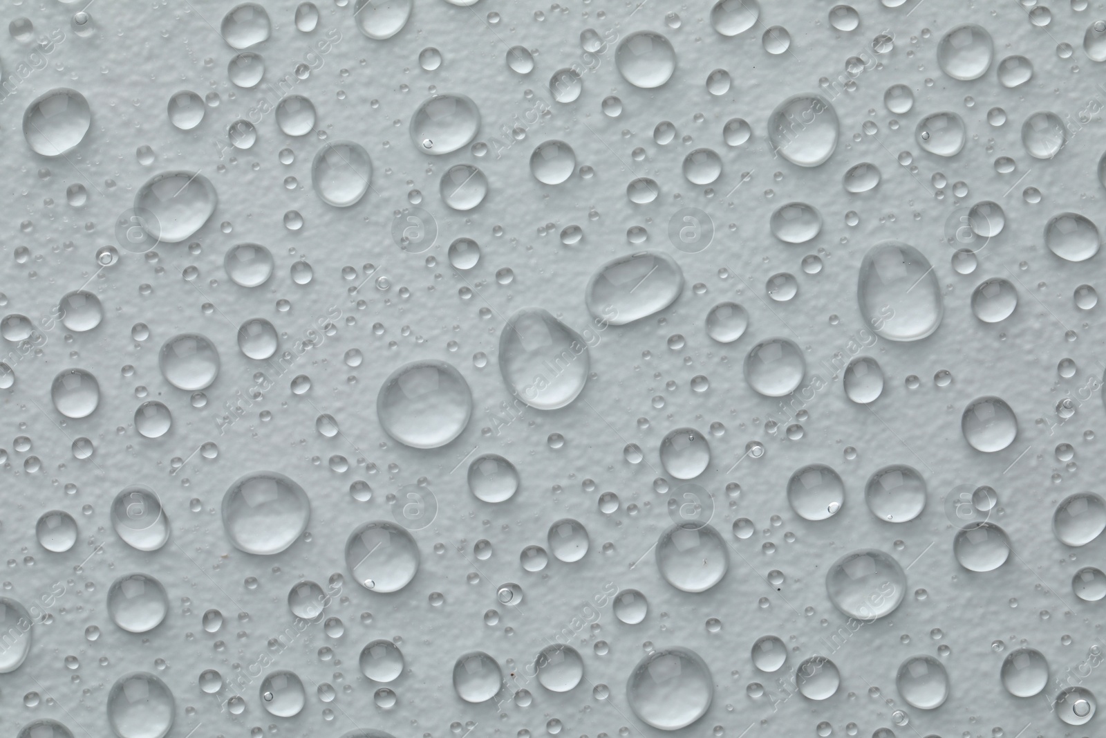 Photo of Water drops on white background, top view