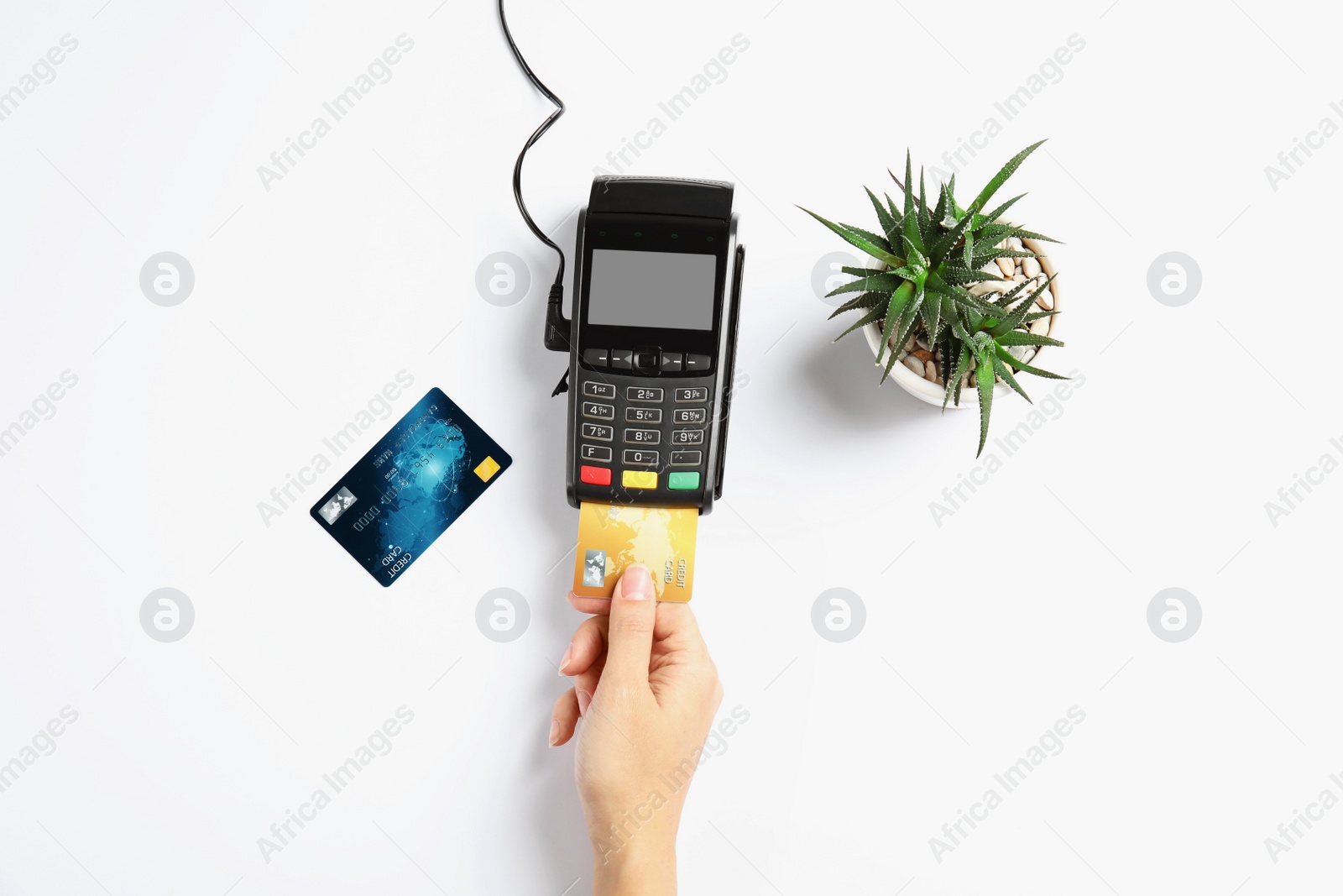 Photo of Woman using modern payment terminal on white background, top view