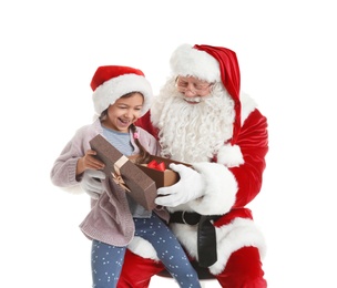 Little girl receiving gift from authentic Santa Claus on white background