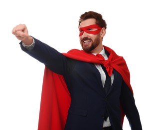 Photo of Happy businessman wearing red superhero cape and mask on white background