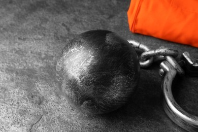 Prisoner ball with chain on grey table