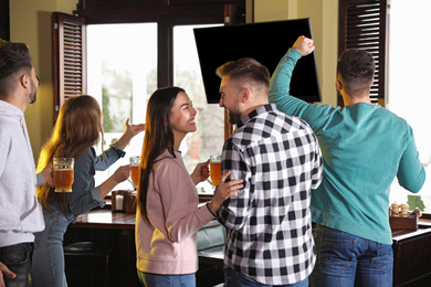 Group of football fans in sport bar