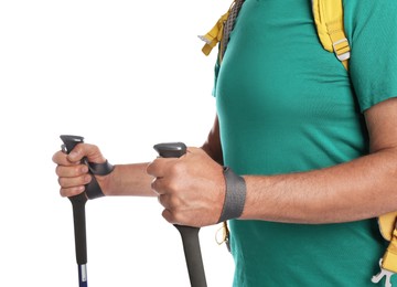 Photo of Male hiker with backpack and trekking poles on white background, closeup