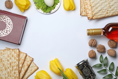 Photo of Flat lay composition with symbolic Passover (Pesach) items on white background, space for text