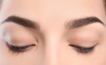 Photo of Beautiful woman with perfect eyebrows, closeup