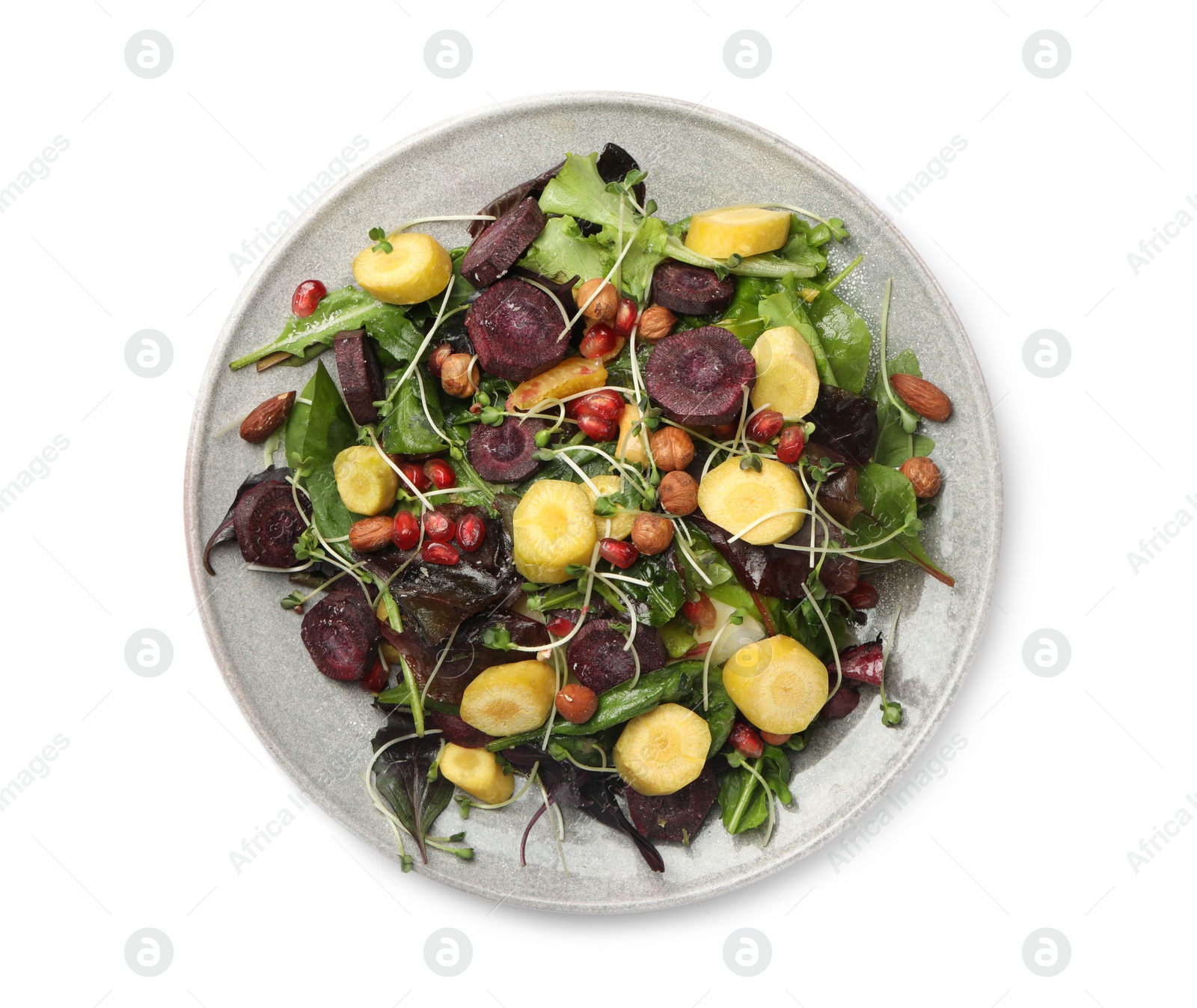 Photo of Delicious fresh carrot salad with pomegranate isolated on white, top view