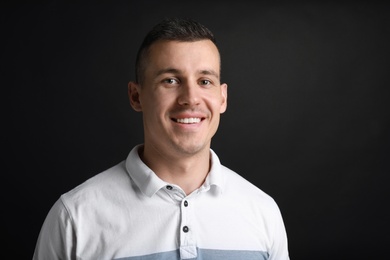 Portrait of handsome man on black background