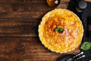 Photo of Delicious pie with minced meat on wooden table, flat lay. Space for text