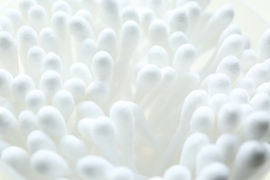 Photo of Many cotton buds as background, closeup view