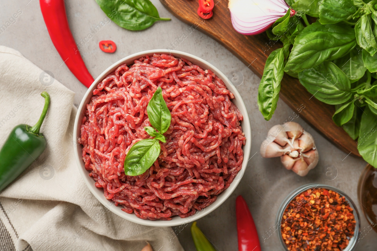 Photo of Flat lay composition with fresh raw minced meat on light table