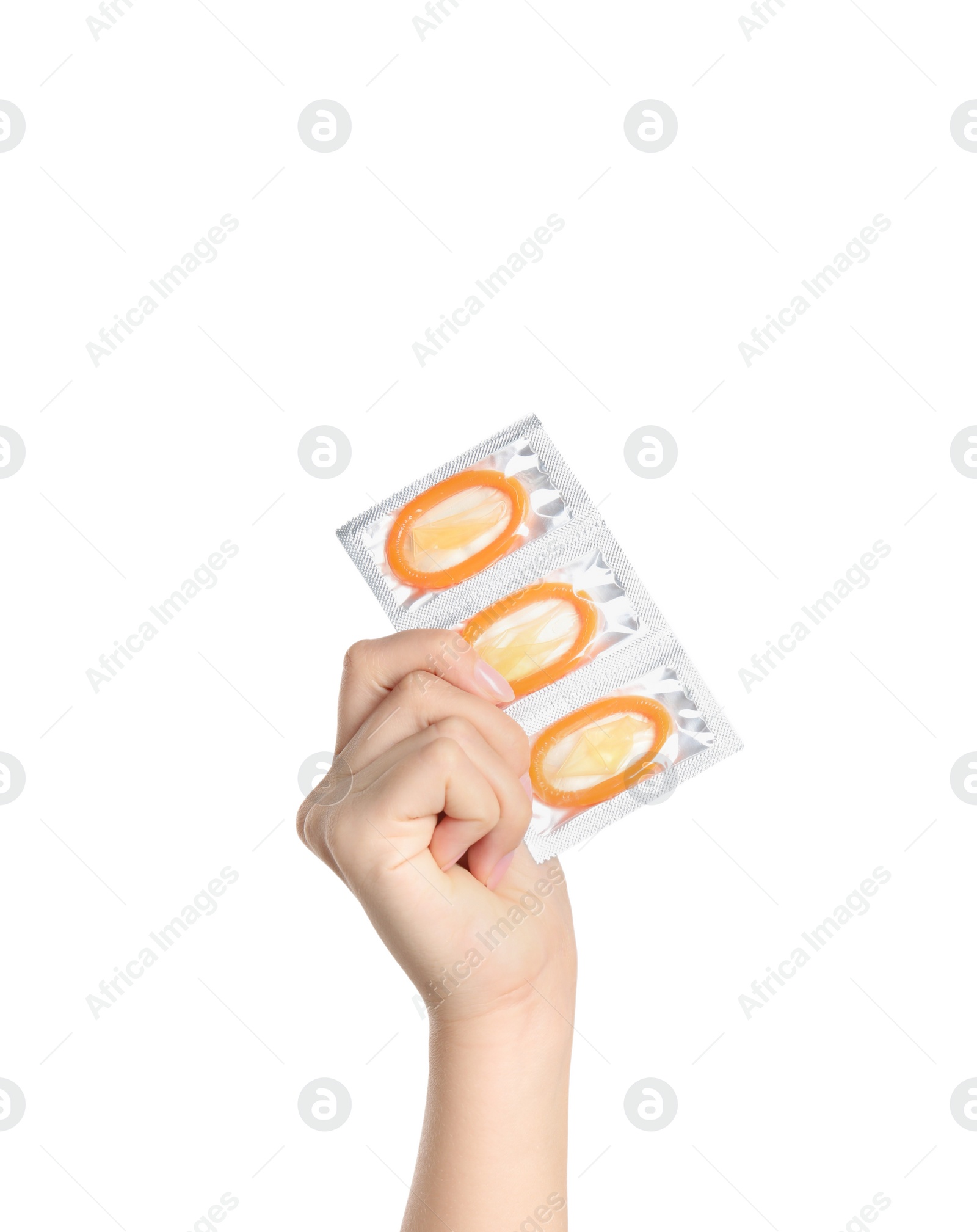Photo of Woman holding condoms on white background, closeup