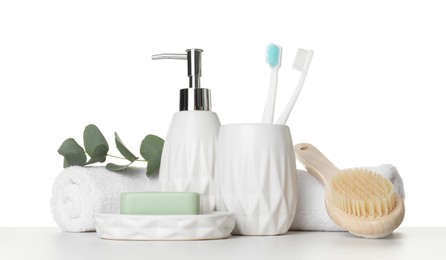 Bath accessories. Different personal care products and eucalyptus branch on table against white background