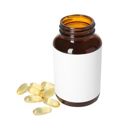 Photo of Bottle and pile of softgel capsules isolated on white