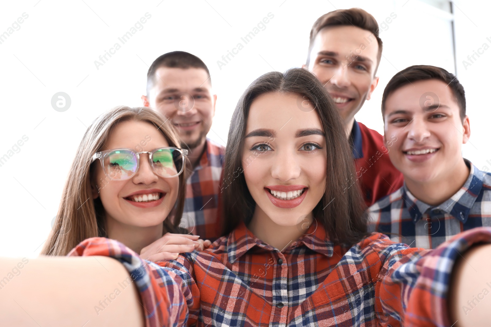 Photo of Happy friends taking selfie indoors