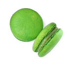 Photo of Delicious green macarons on white background, top view