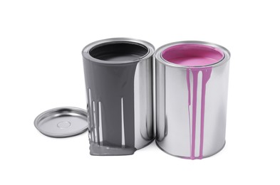 Photo of Cans of grey and pink paints isolated on white