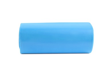 Photo of Roll of turquoise garbage bags on white background. Cleaning supplies