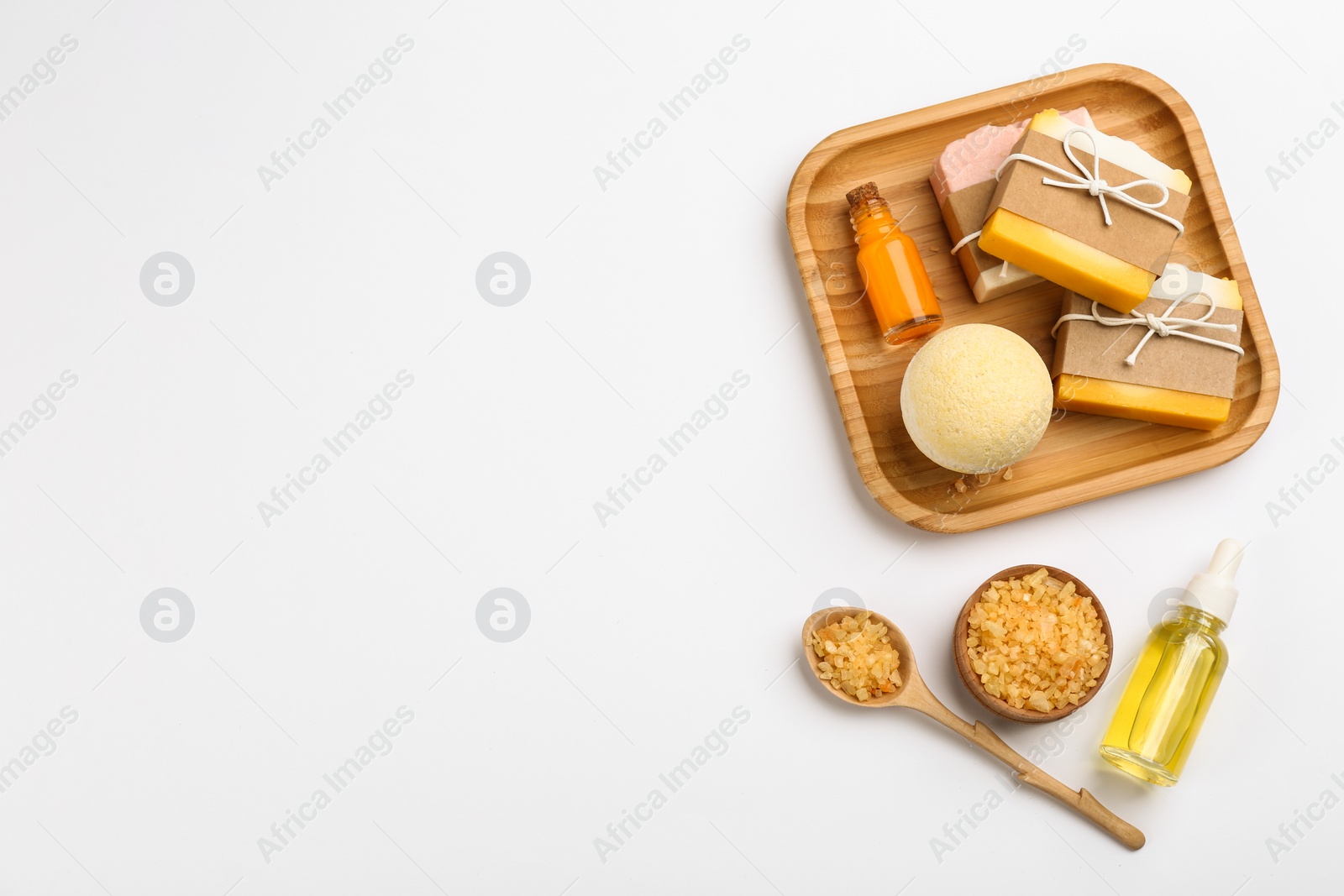 Photo of Natural handmade soap and ingredients on white background, top view