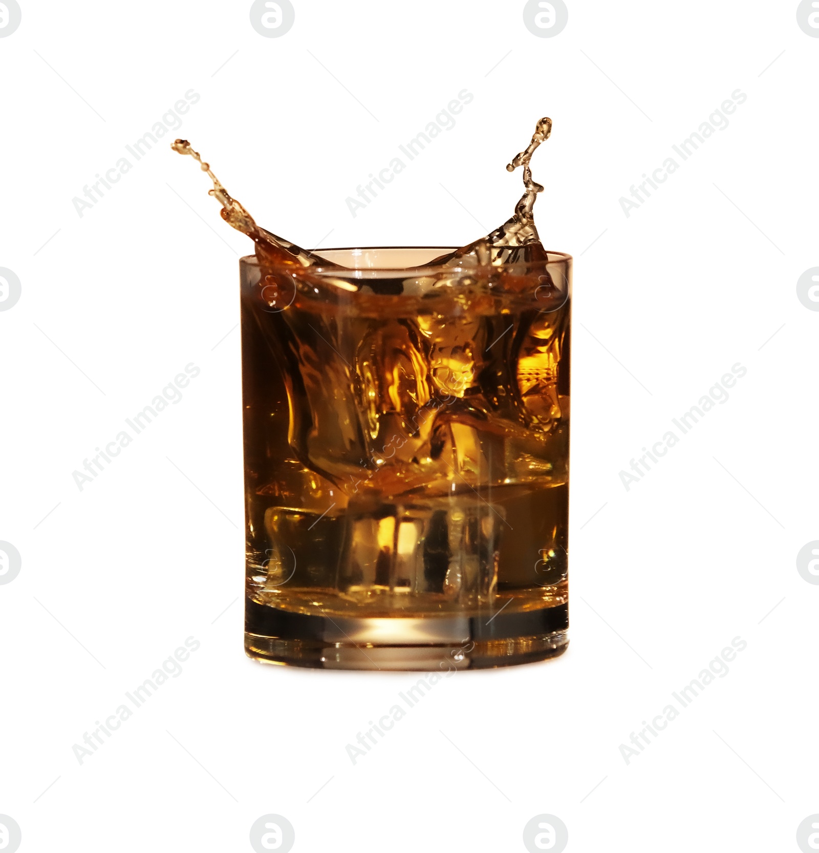 Photo of Whiskey splashing out of glass on white background