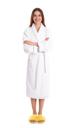 Young woman in bathrobe on white background