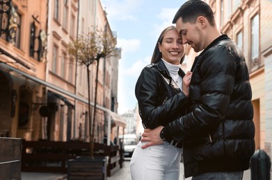 Lovely young couple enjoying time together outdoors. Romantic date