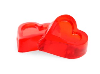 Tasty heart shaped jelly candies on white background