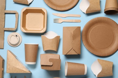 Flat lay composition with eco friendly food packagings on light blue background