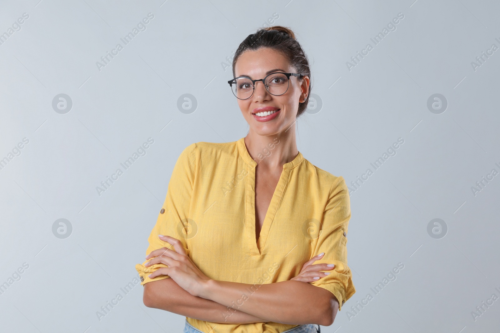 Photo of Beautiful woman in eyeglasses on white background