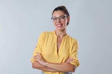 Photo of Beautiful woman in eyeglasses on white background